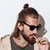 Hipster man looking aside isolated over wall